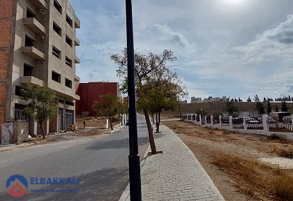 Geteelde bouwgrond in een woonwijk te koop